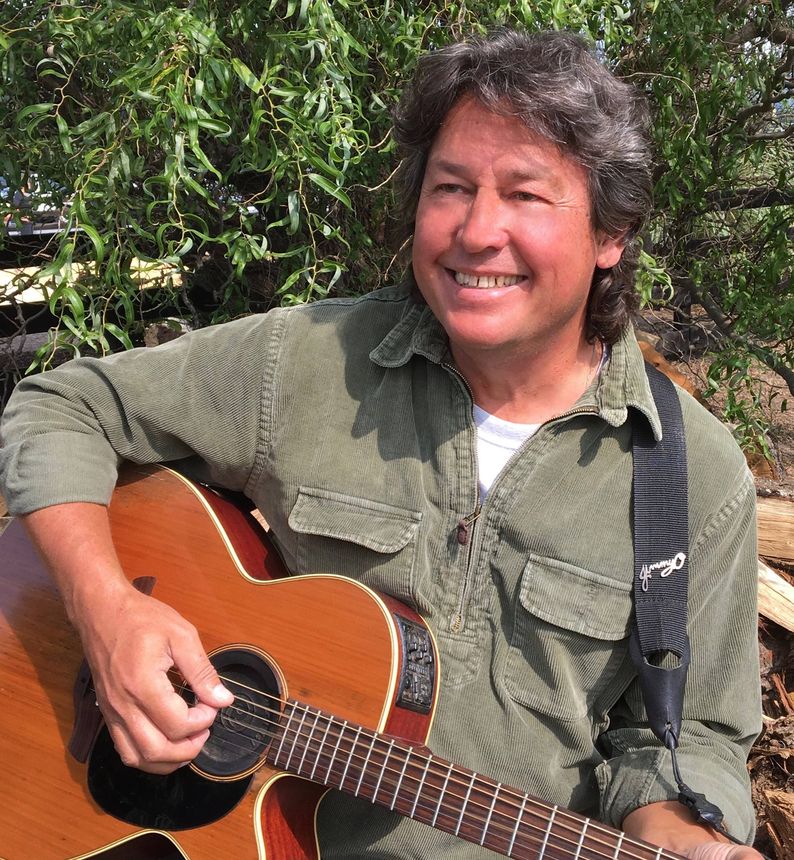 Jimmy O playing guitar at Cardinal Point Winery